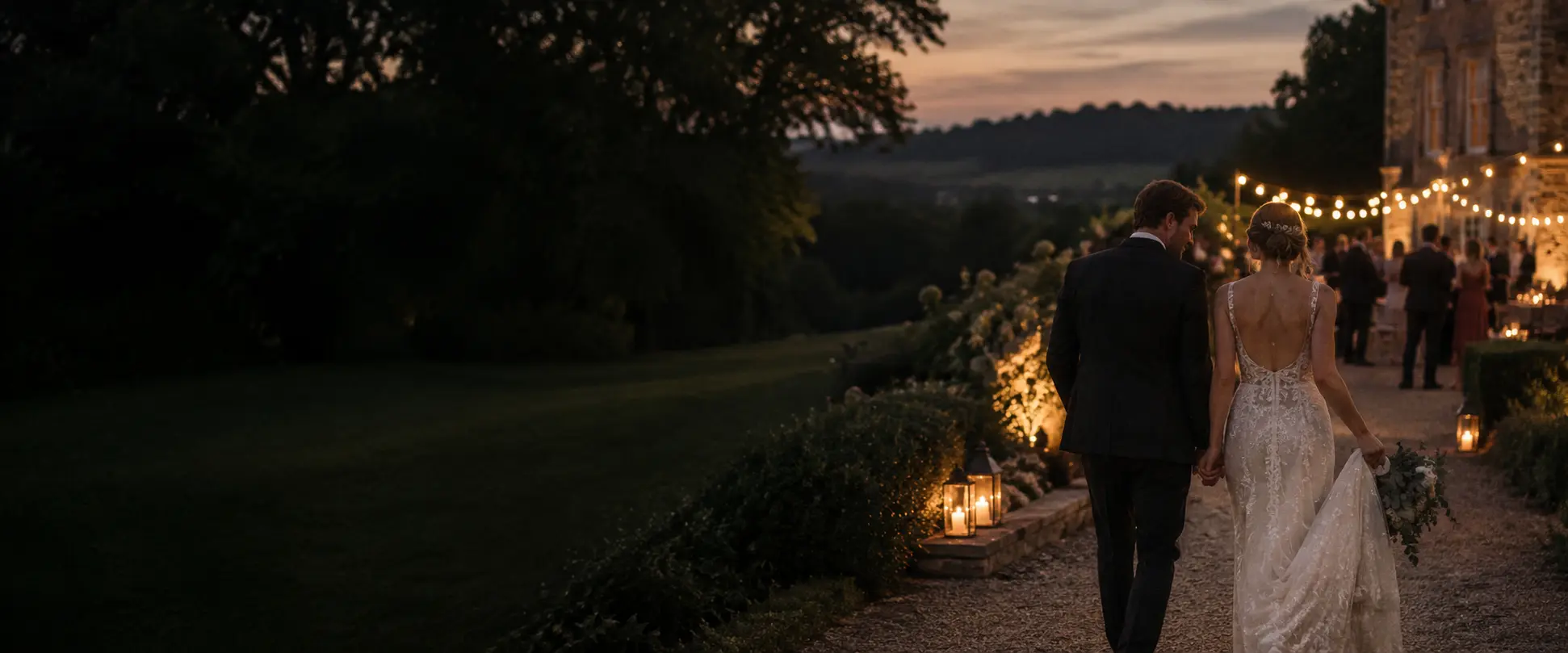Newlyweds walking towards their evening wedding celebration